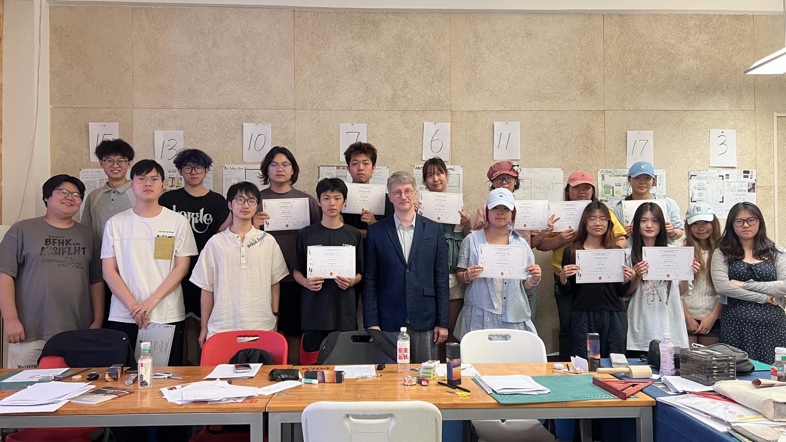 Students with certificates after the interior design course